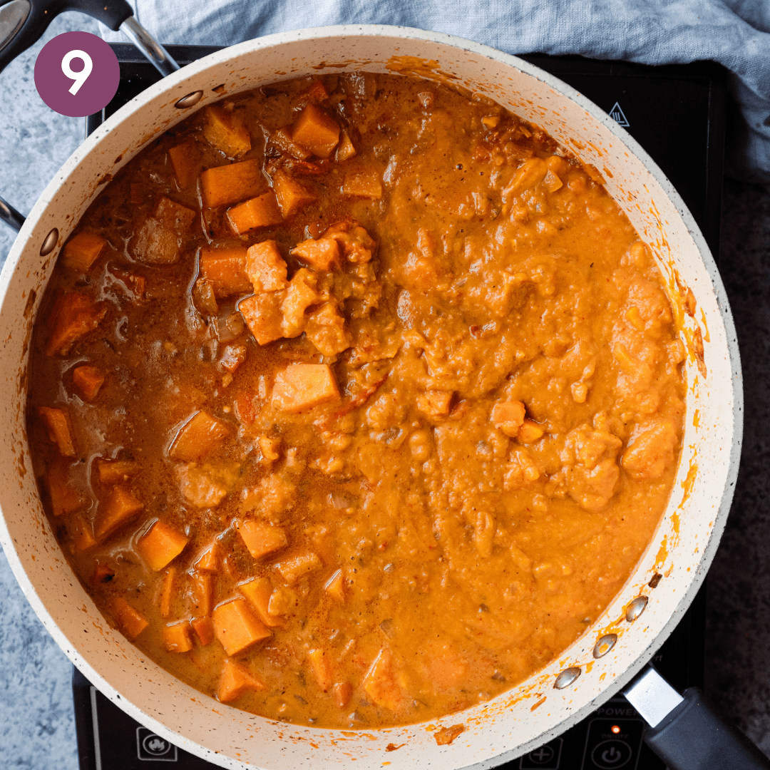 partially pureed butternut squash curry in a saute pan.