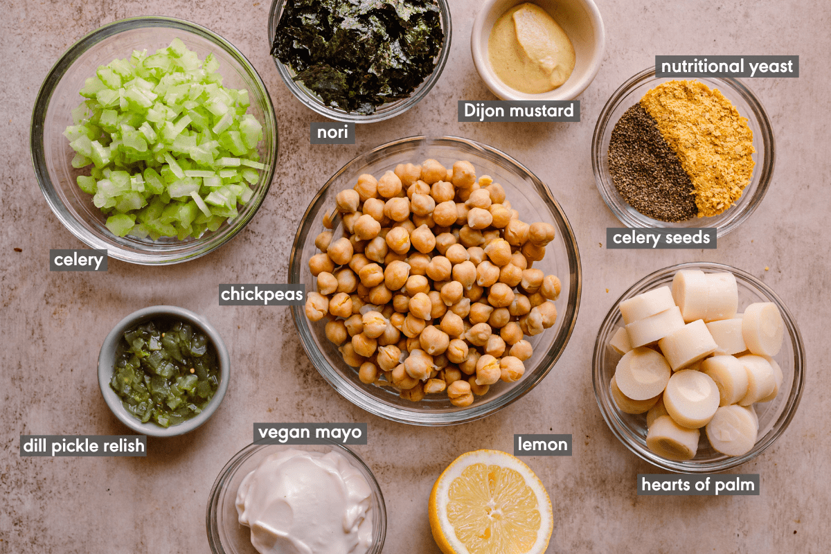labeled ingredients for vegan tuna salad on a light pink cutting board.