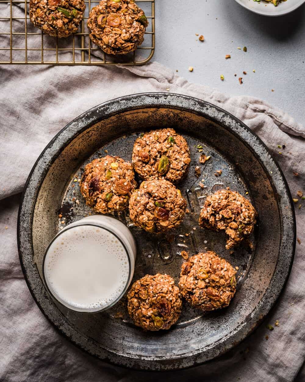cookies and milk on a plate on a table.
