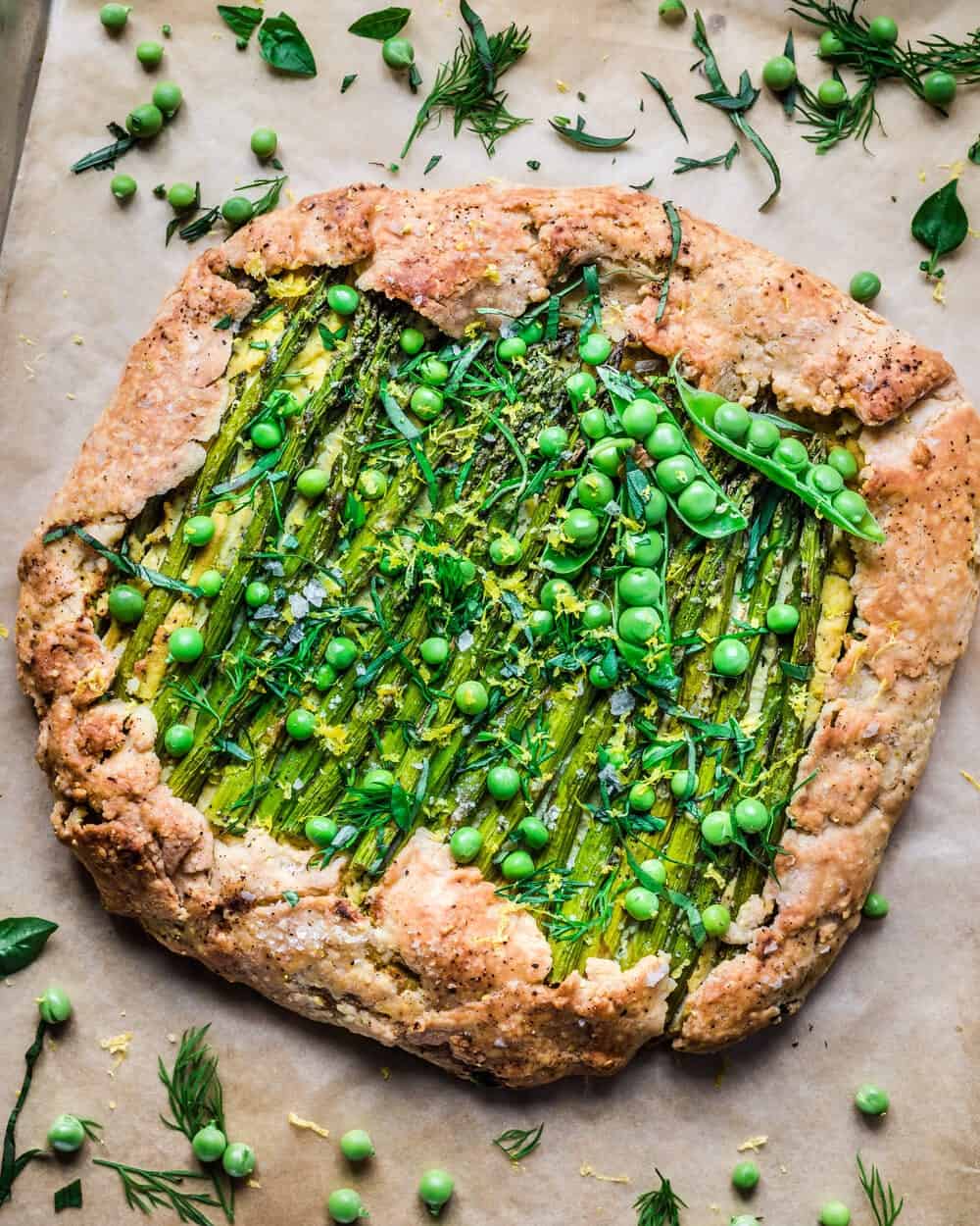 Full baked galette on a piece of parchment paper.