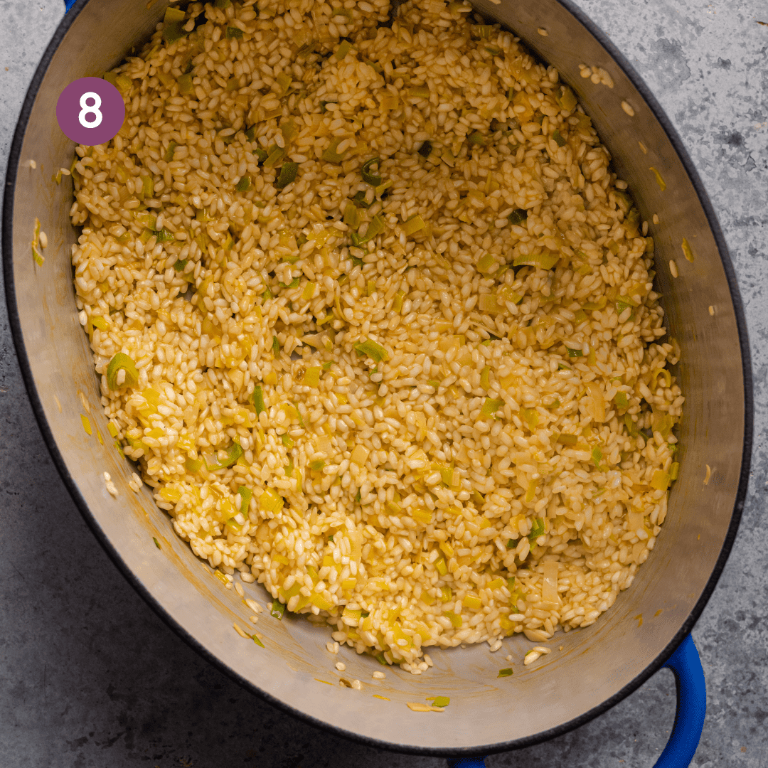 process step of making vegan risotto, just after vegetable broth has been added.