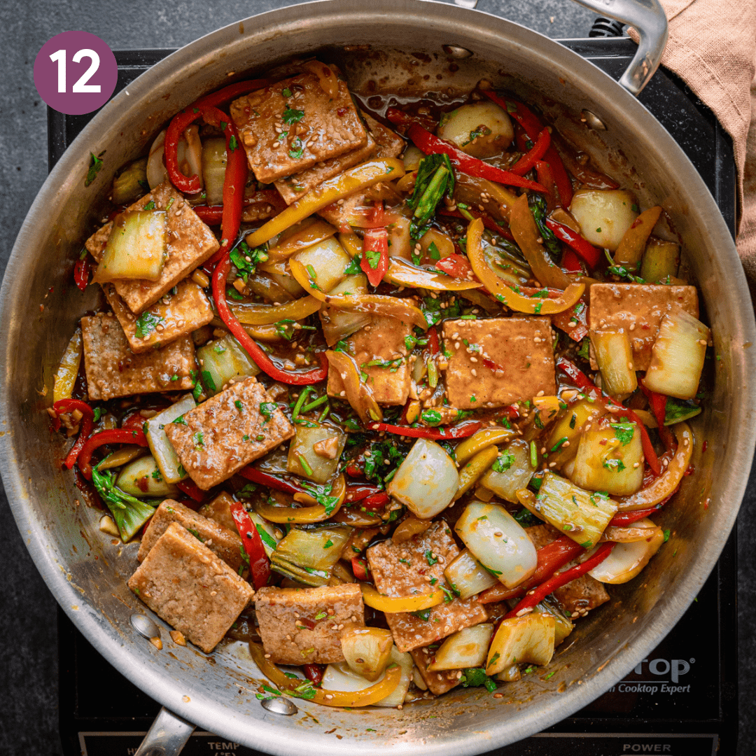 Finished stir fry in pan after being mixed together.
