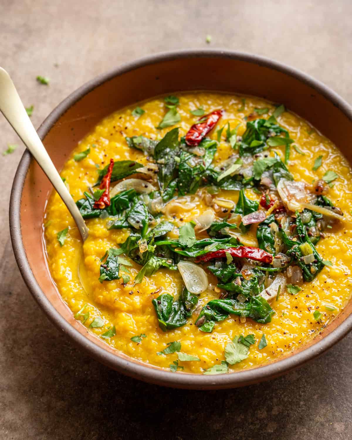 Dal palak in bowl on a table.