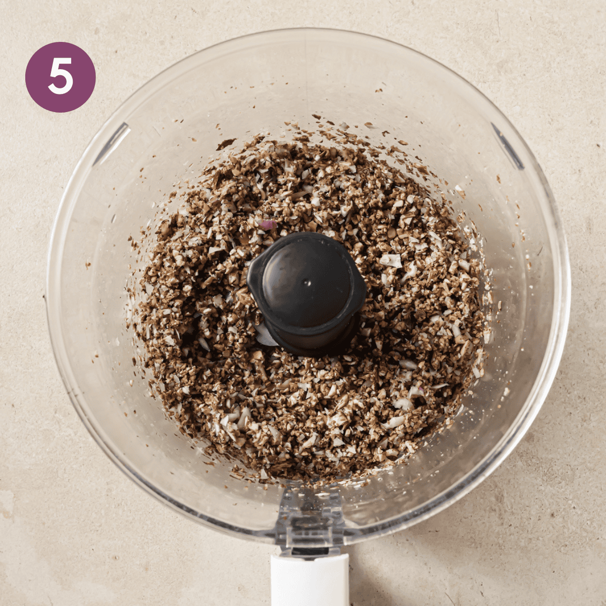 mushrooms, shallots, and walnuts blended finely in a white food processor.