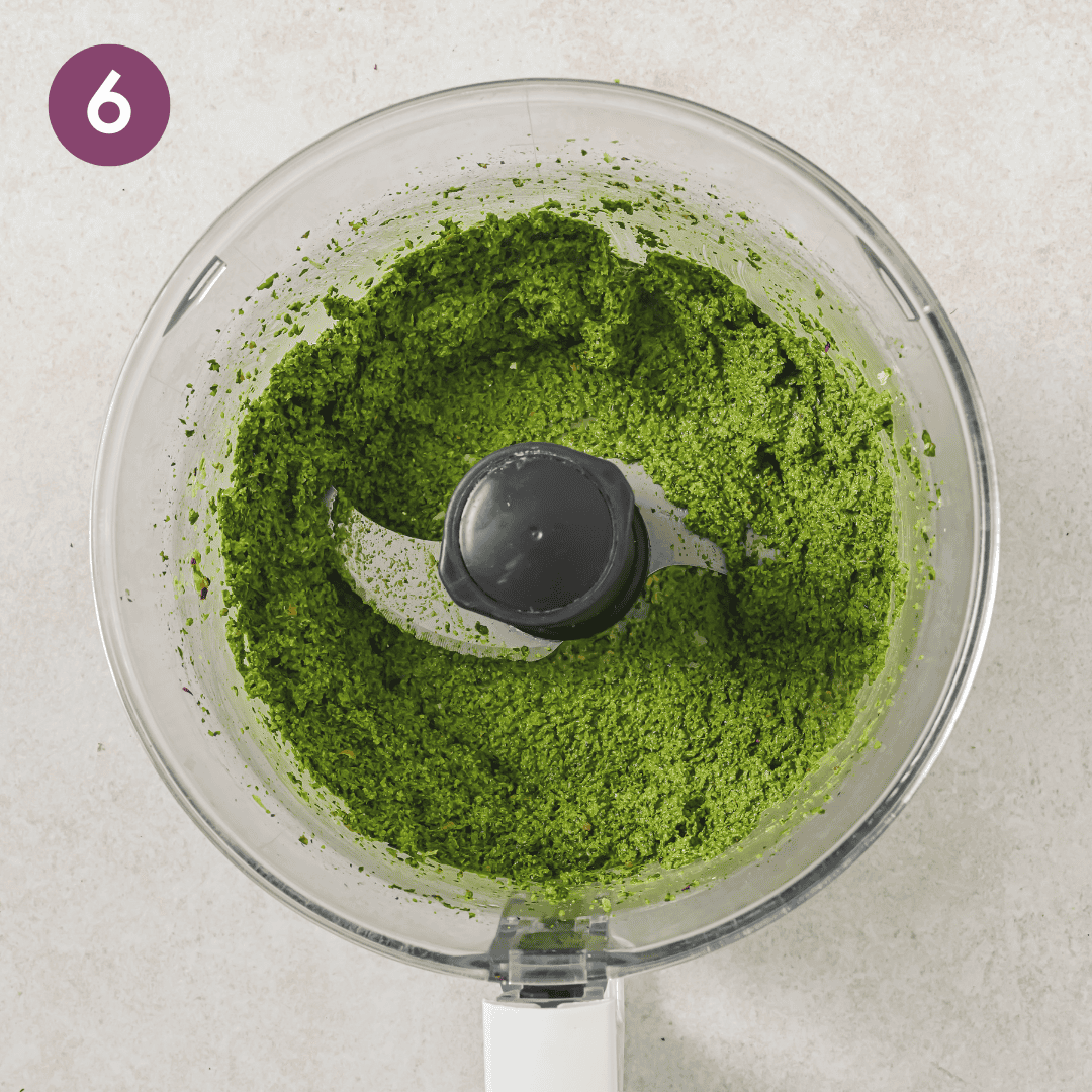 the pesto paste blended up before the olive oil is streamed in.