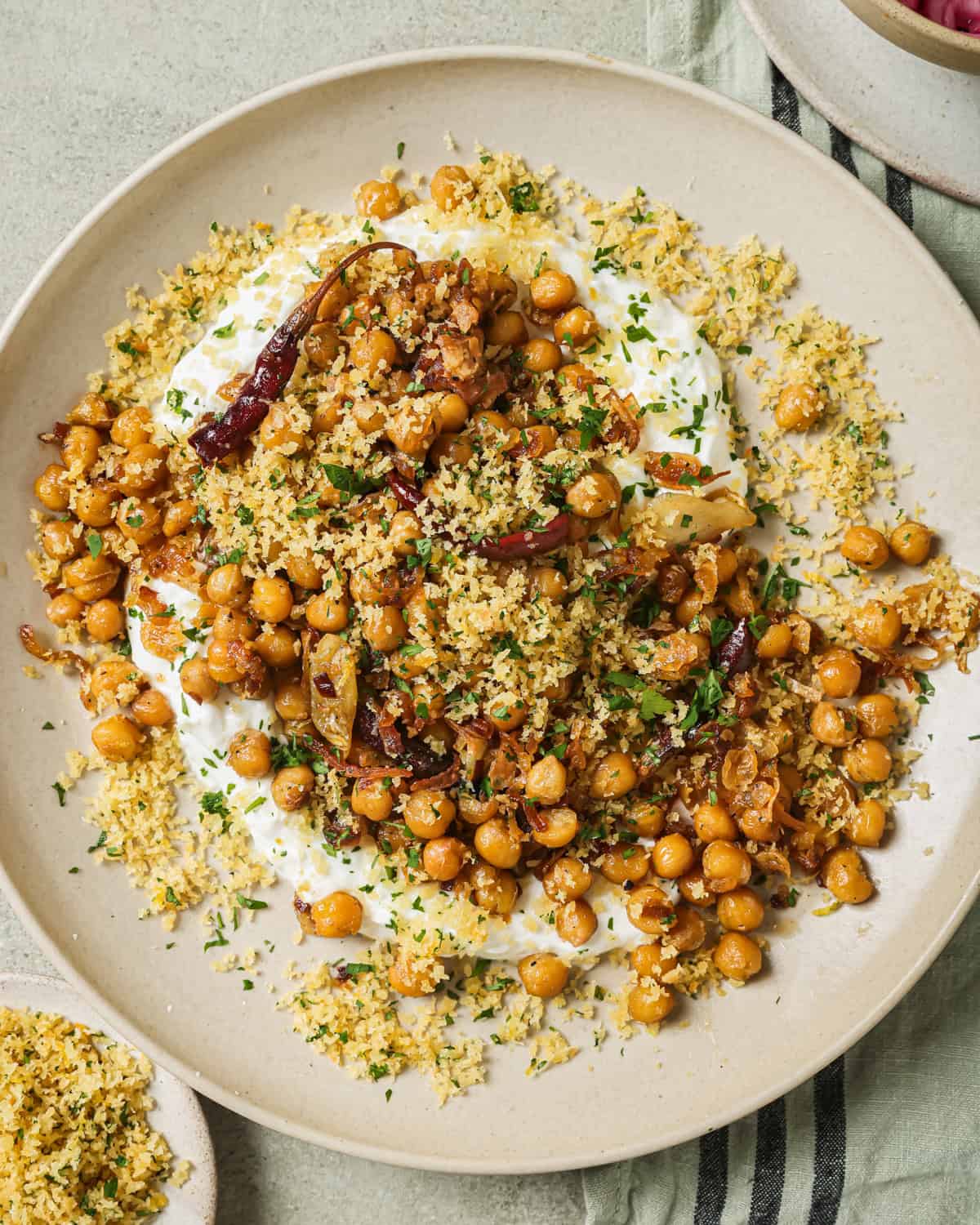 fried chickpeas and yogurt sauce on a plate.